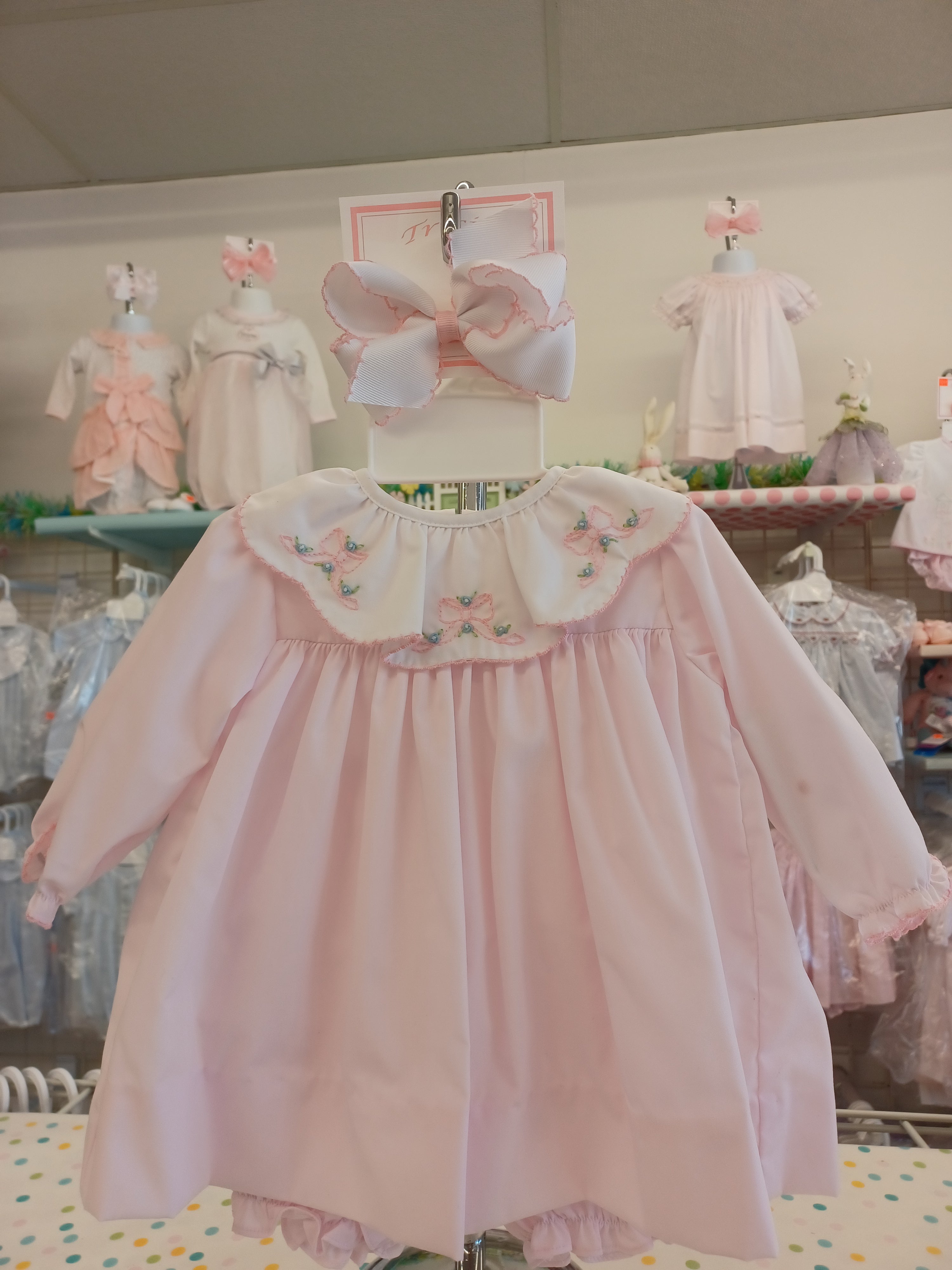 Newborn long sleeve dress with bloomers and bows.