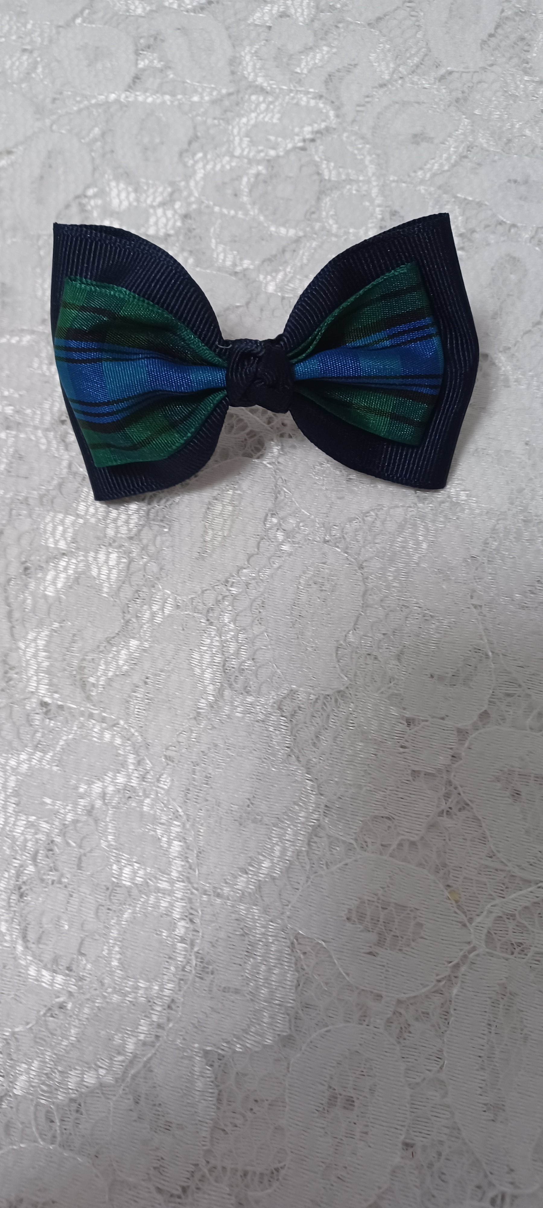Navy Barrette Bow With Green And Navy Plaid Overlay On The Bow