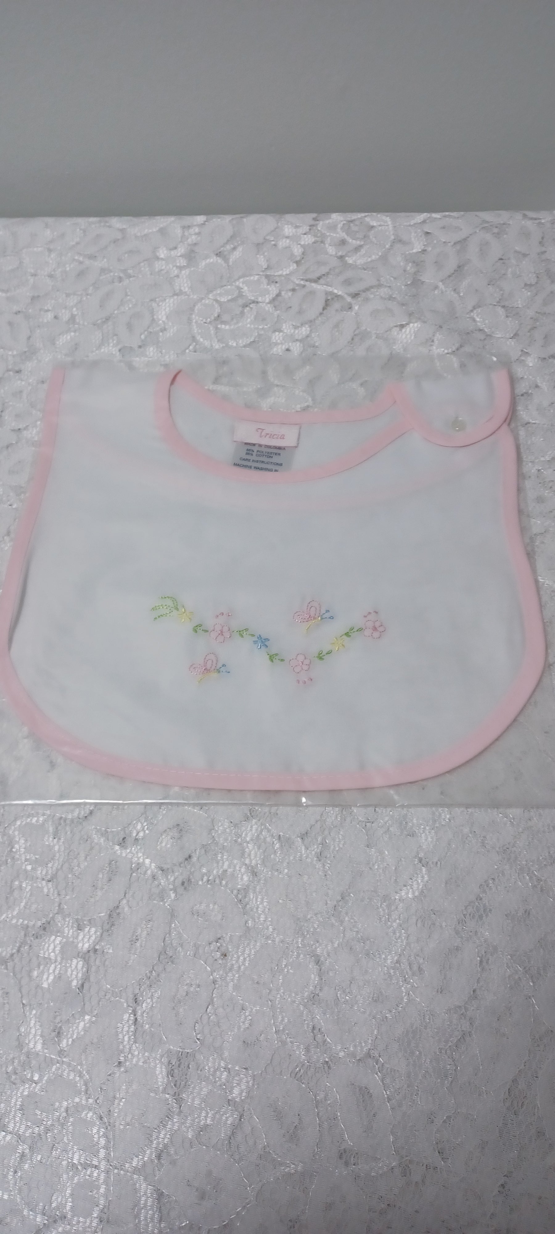 Girls Bib With Embroidery And Pink Trim